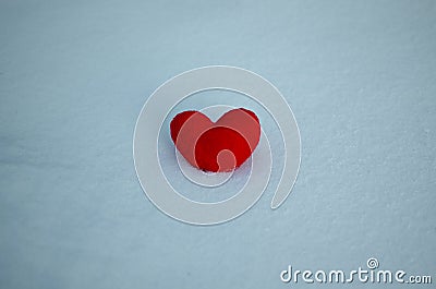 Red heart on the snow. Background Valentine`s day , place for text, love heart Stock Photo