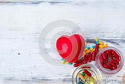 Red heart model and pharmaceutical products Stock Photo