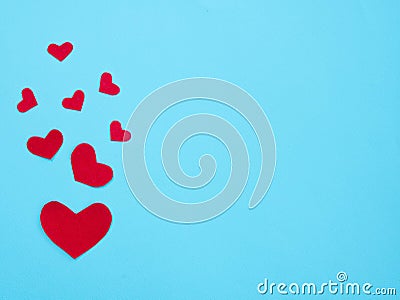 Red hearts on a blue background. Stock Photo