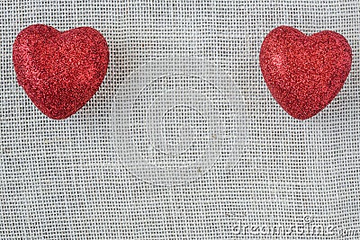 Red Hearts on Burlap Background Stock Photo