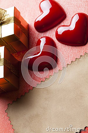 Red hearts, gift boxes and blank paper sheet Stock Photo