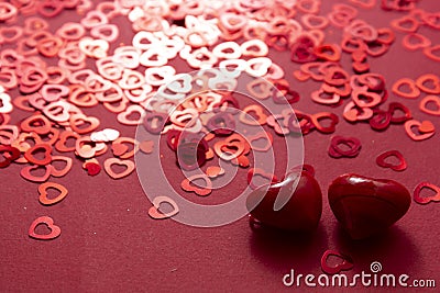 Red hearts glitter confetti Valentine day abstract background Stock Photo