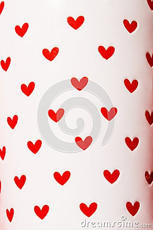 Red hearts painted on white ceramic. Stock Photo