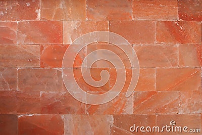 Red himalaya salt bricks wall texture Wallpaper background Stock Photo