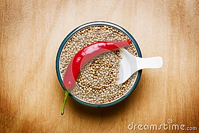 Red hot chili Coriander on wood table Stock Photo