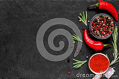 Red hot chili peppeprs and peppercorns with rosemary and garlic Stock Photo