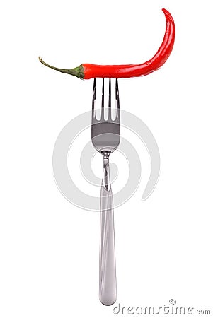 Red hot chili pepper pricked on the steel fork Stock Photo