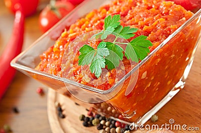 Red hot chili pepper and sauce on glass bowl Stock Photo