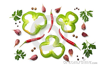 red hot chili peppers with parsley, garlic and cut slices of green sweet bell pepper isolated on white background top view Stock Photo