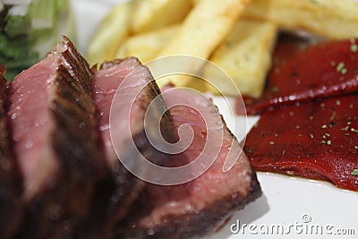 Red hot chilli peppers & beef steak Stock Photo