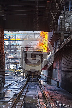 Red hot coke falls into the quench wagon Stock Photo