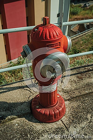 Red hydrant on concrete sidewalk Editorial Stock Photo