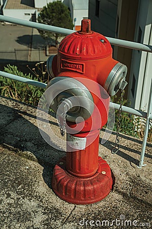 Red hydrant on concrete sidewalk Editorial Stock Photo