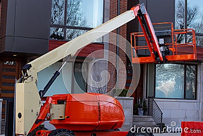 red hydraulic utility lift used in the construction industry machine mobile crane Stock Photo