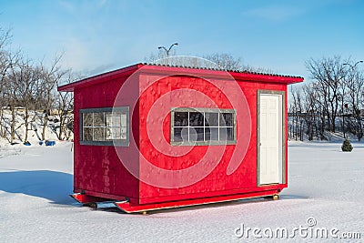 Red Ice Fishing Cabin in Ste-Rose Stock Photo