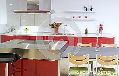 Red island kitchen silver modern interior house Stock Photo
