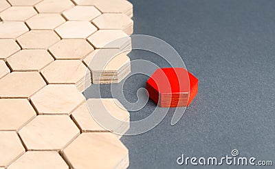 Red item is disconnected from other items. Hexagons. The concept of separating parts from a whole or connecting parts to a whole Stock Photo