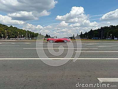 Red Jaguar E-Type car on street during retro-cruise Editorial Stock Photo