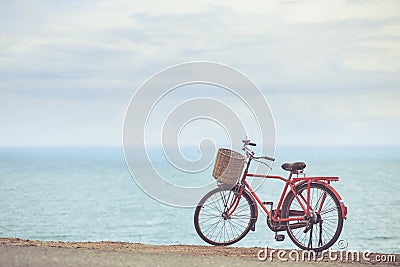 Red Japan style classic bicycle at ocean view point