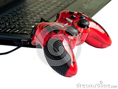 Red joystick game controller on laptop . Stock Photo