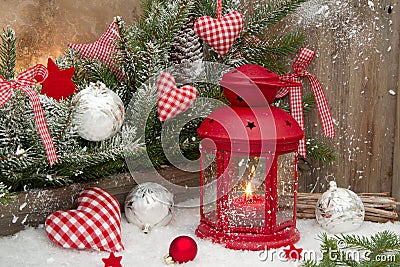 Red lantern with candlelights an checked heards for a christmas Stock Photo