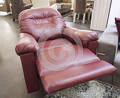 Red leather armchair in show room Stock Photo