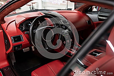 Red leather seats in car. Modern luxury sport car interior. Stock Photo