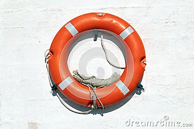 Red Life Buoy hanging on the wall Stock Photo