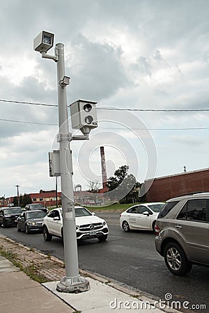 red light camera picture and video two cameras on silver post with traffic. p Editorial Stock Photo