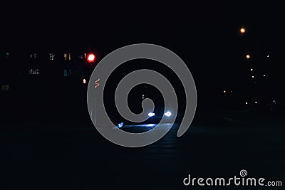 Red light at the intersection at night Stock Photo