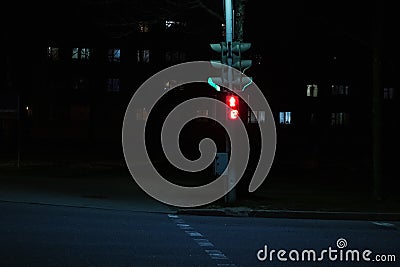 Red light at the intersection at night Stock Photo