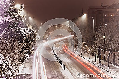 Red light trail on a wintertime road in Cosenza, Calabria, Italy Stock Photo