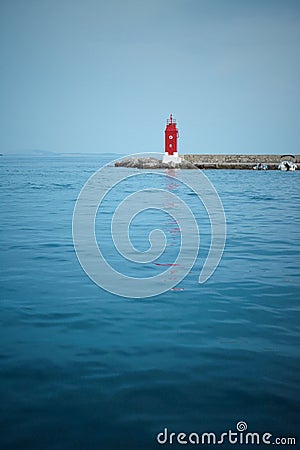 Red lighthouse in boat port Stock Photo