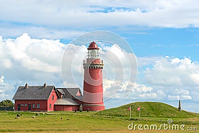 The red Lighthouse Bovbjerg Fyr with green grass and blue sky, J Stock Photo