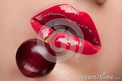 Red lips with a cherry. Stock Photo