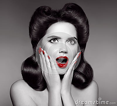 Red lips and manicured nails. Surprised pin up girl holds cheeks Stock Photo