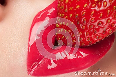 Red lips with strawberry. Stock Photo