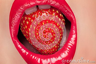 Red lips with strawberry. Stock Photo