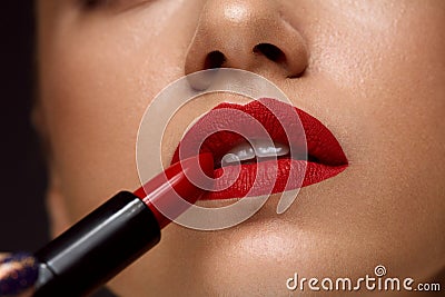 Red Lipstick. Closeup Of Woman Face With Bright Lips Makeup Stock Photo