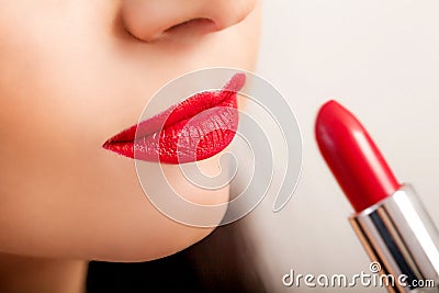 Red Lipstick. Closeup Of Woman Face With Bright Red Matte Lipstick On Full Lips. Beauty Cosmetics, Makeup Concept. High Resolution Stock Photo