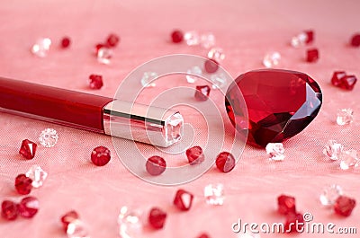 A red lipstick and a red diamond Stock Photo