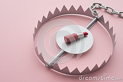 Red lipstick in a trap on pink background copy space. Online internet romance scam or swindler in website application dating Stock Photo