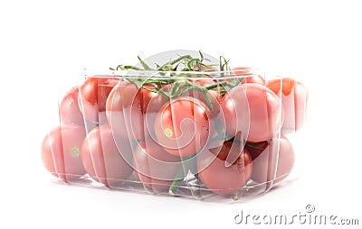 Red, little, cherry tomatoes on a plastic container on a white background Stock Photo
