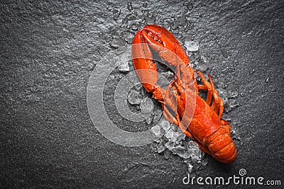 Red lobster seafood with ice on dark backgroud top view Stock Photo