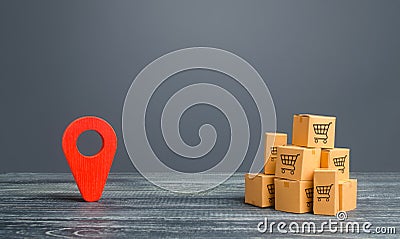 Red location pointer geolocation symbol and cardboard boxes. Distribution delivery of goods, freight transportation shipment. Stock Photo