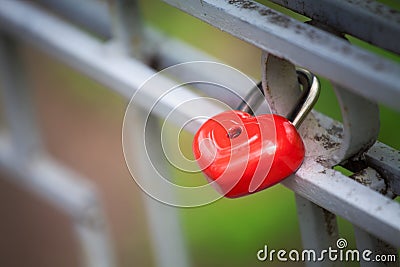 Red lock in shape of heart Stock Photo