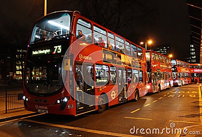 Red London buses outside Euston railway station. Editorial Stock Photo