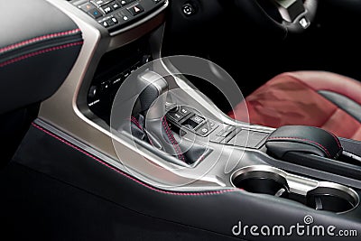Red luxury car Interior with steering wheel, shift lever and air Stock Photo