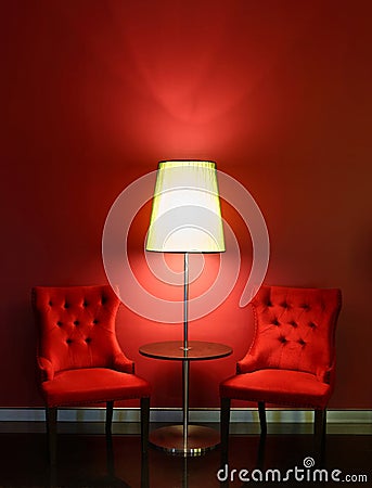 Red luxury chairs with table and lamp Stock Photo