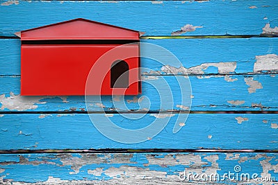 Red mailbox with blue wood Stock Photo